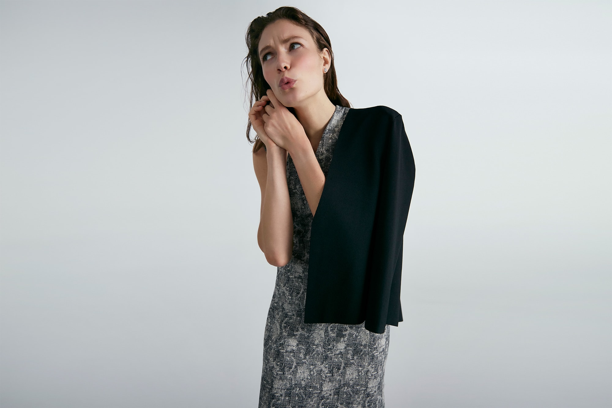Woman wearing the Aditi dress and Woolf jardigan