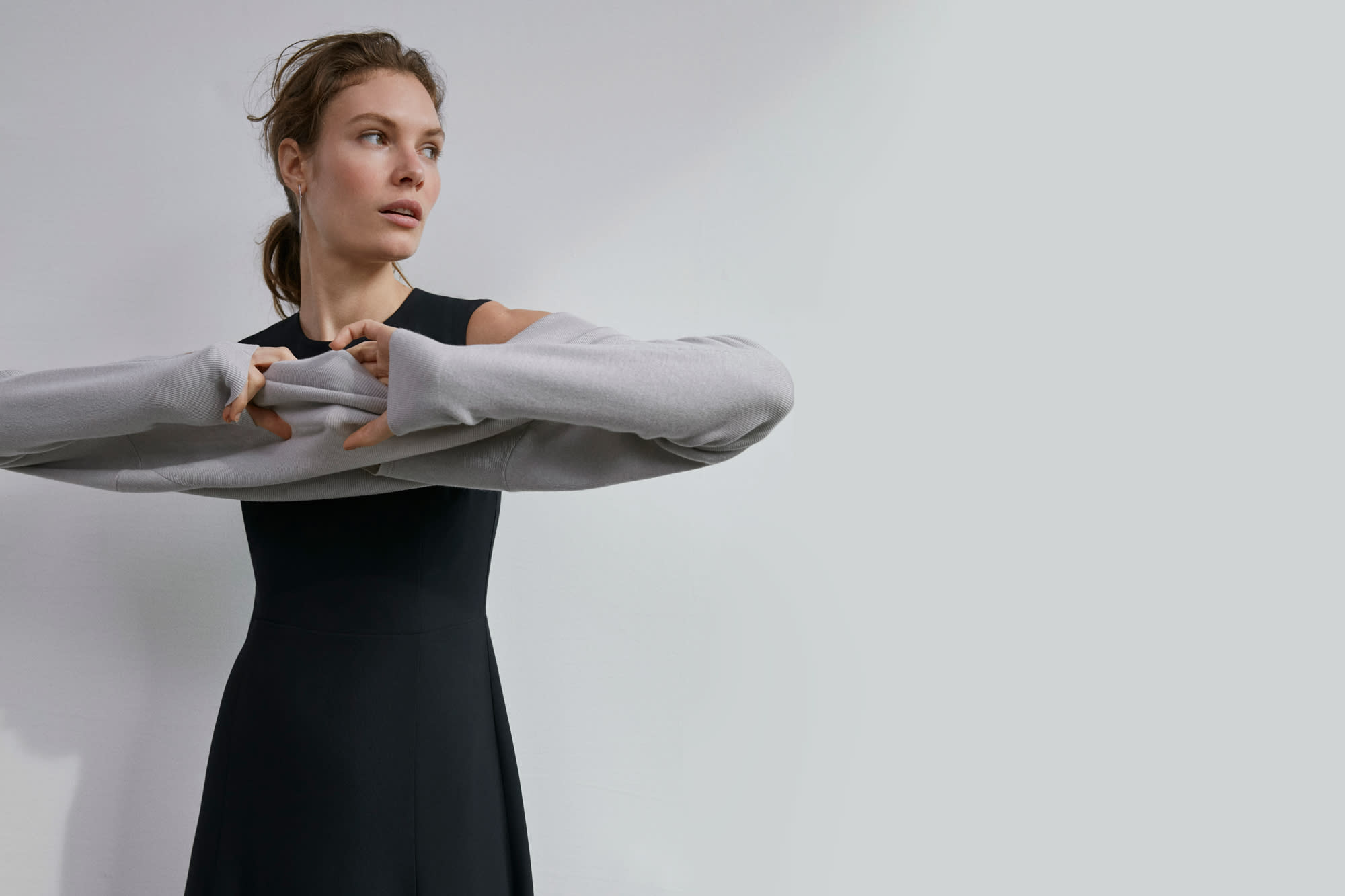 Woman wearing the Jane dress and Butler sweater