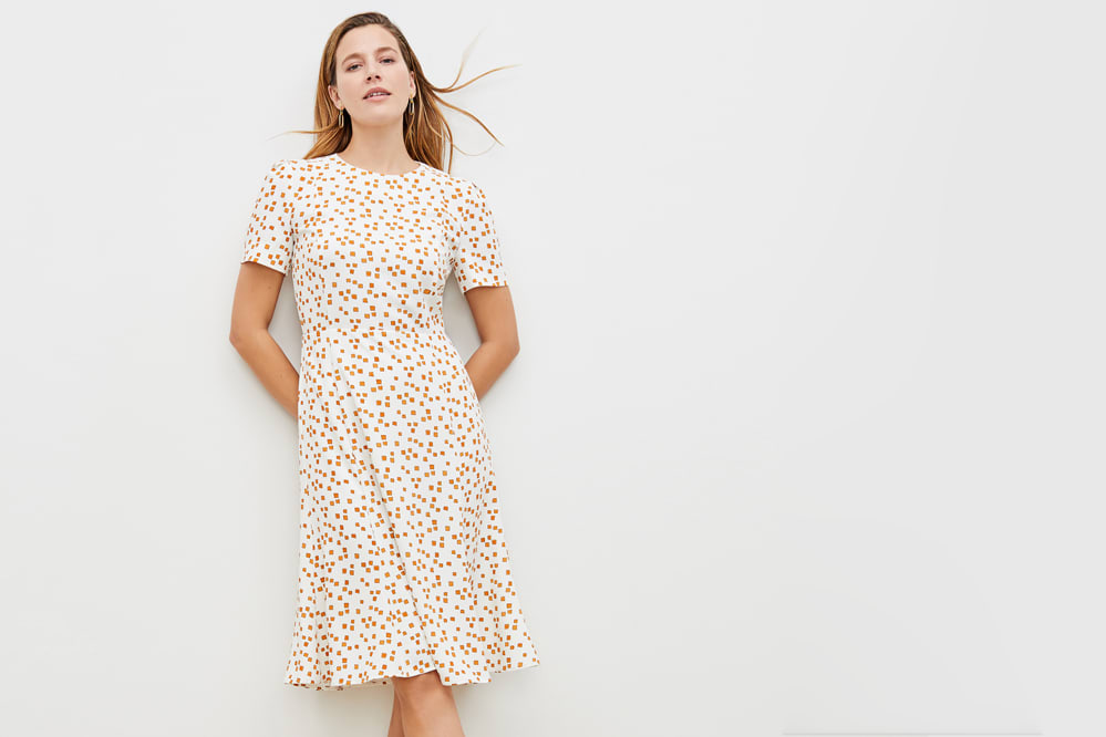 Woman wearing the Inez dress in mosaic print.