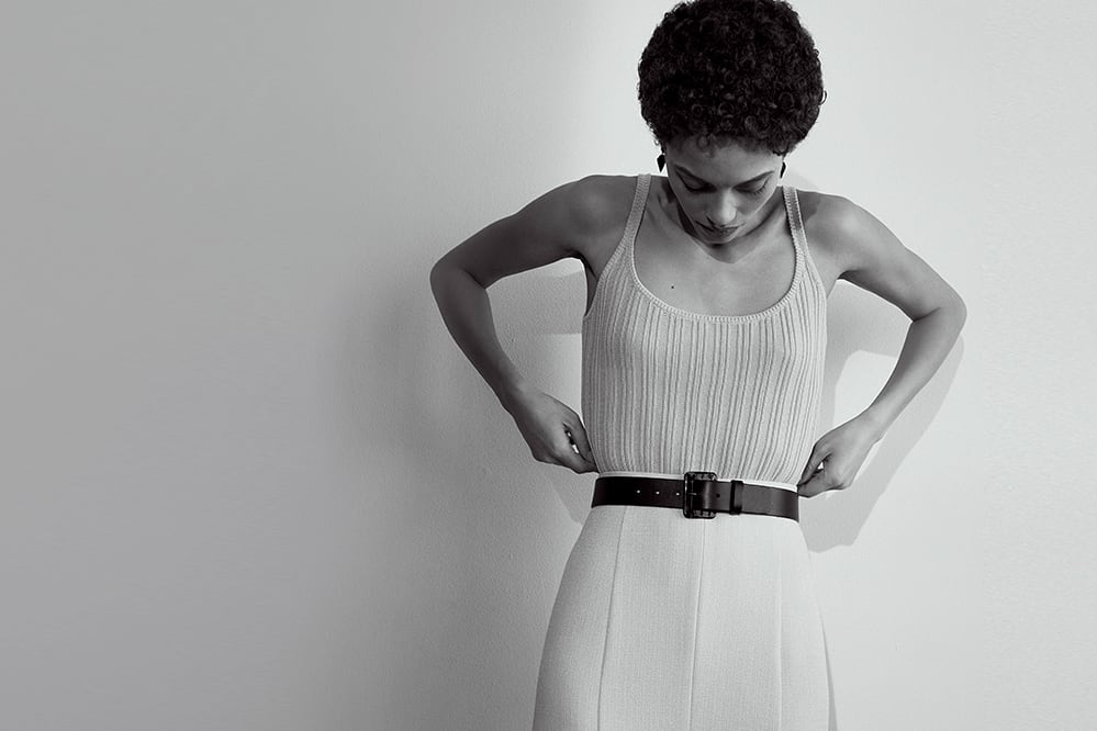 Woman wearing the Rochelle tank top and the Eva skirt.