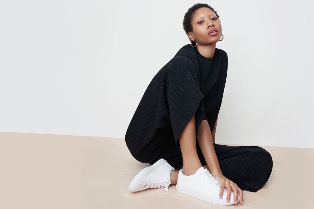 Woman wearing the Zhou culotte, Para pullover, and KOIO sneakers.