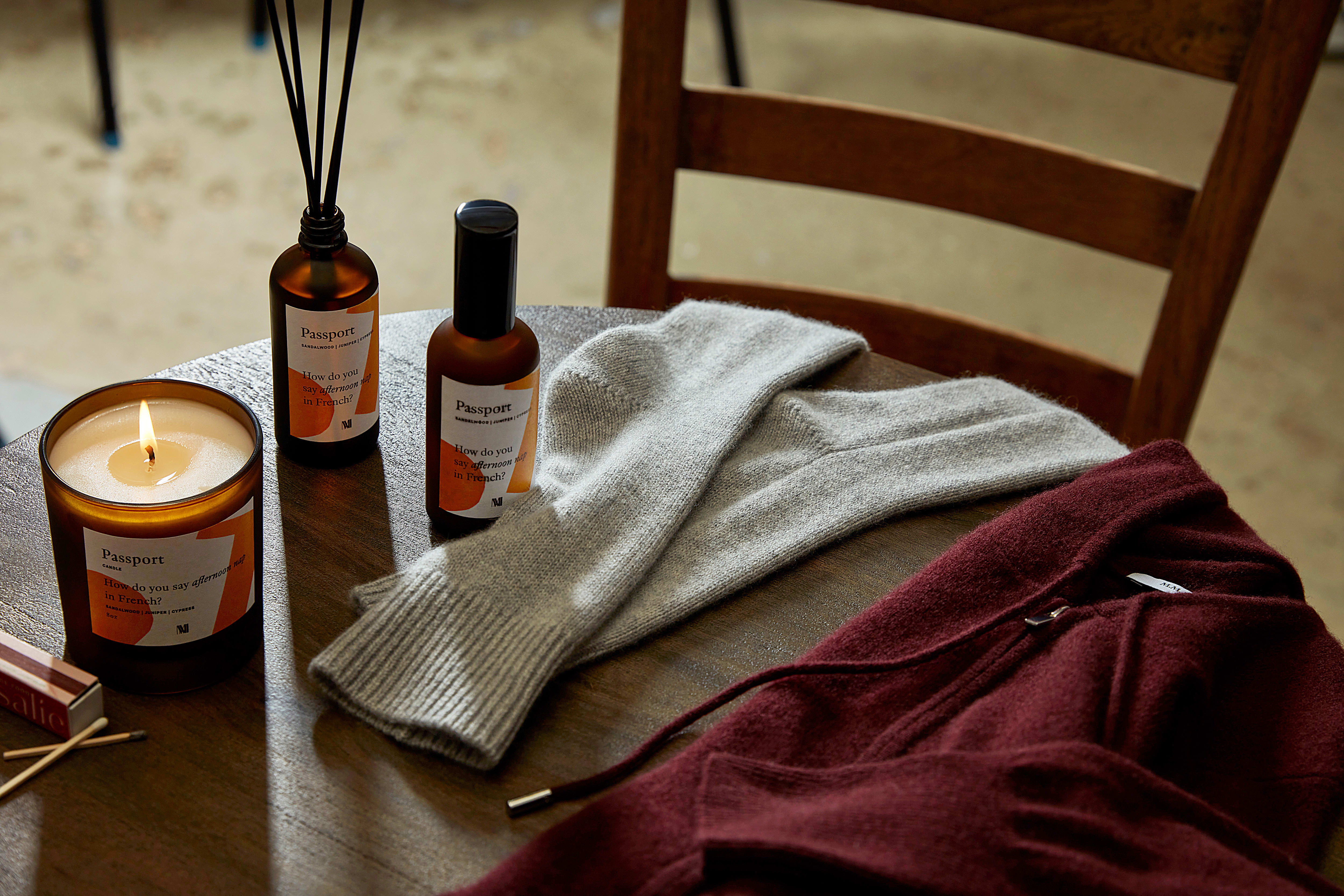 Scent Diffuser + Candle + Room Spray + Cashmere Socks + Judith Hoodie on table