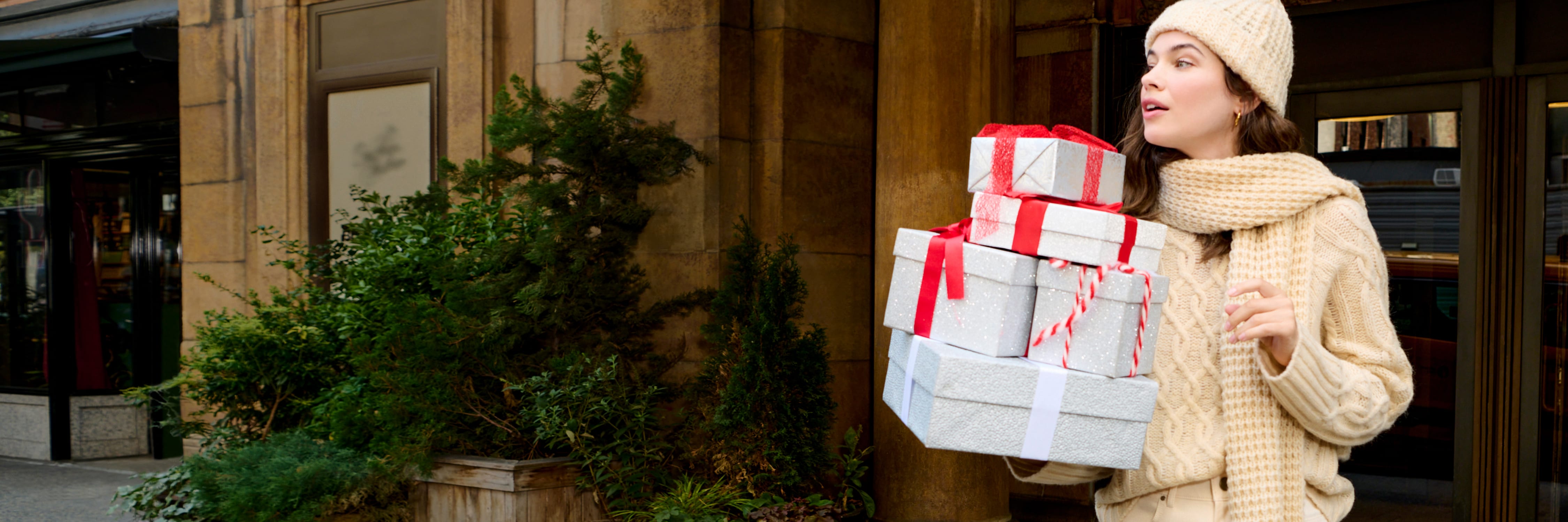 image of a woman carrying gifts