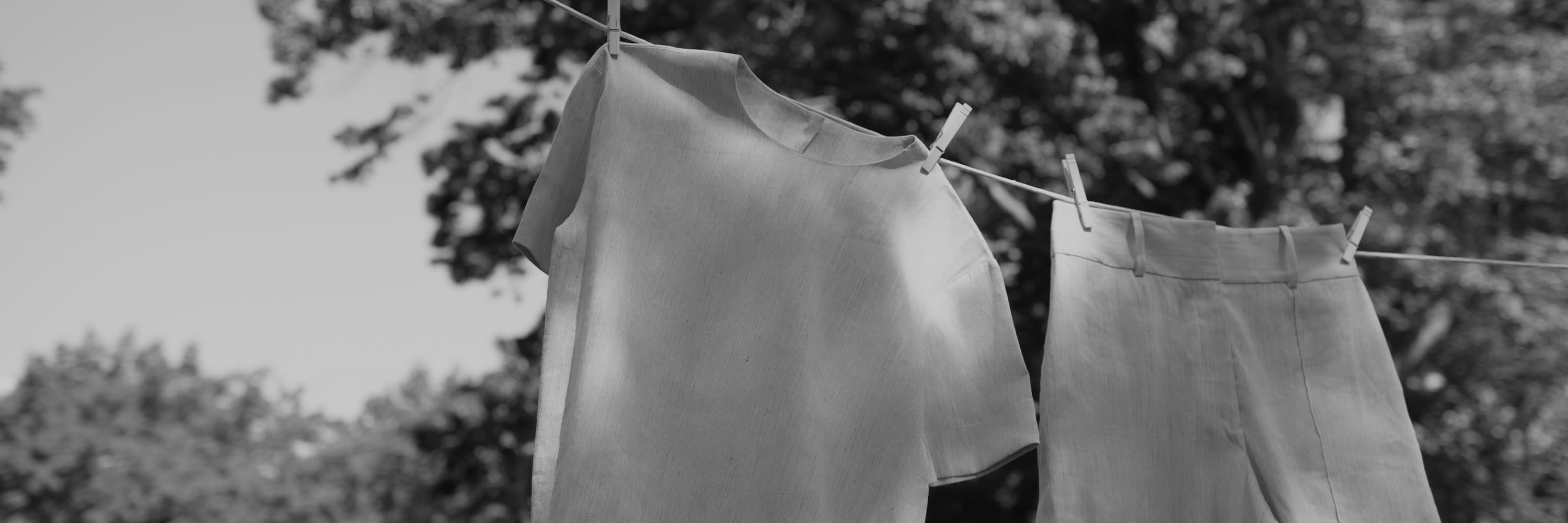 A shirt and shorts hanging on a clothesline