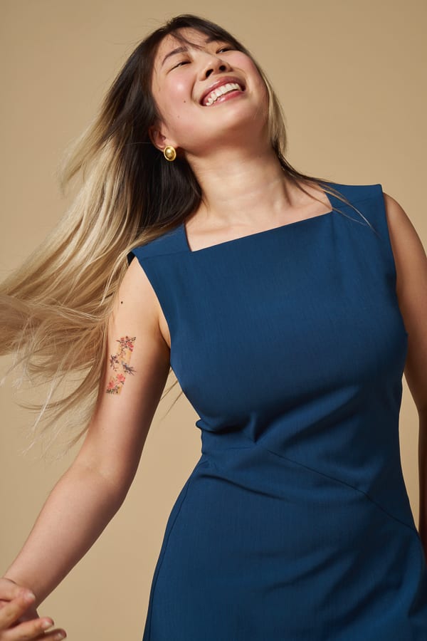 image of a woman wearing the pauline dress in deep teal