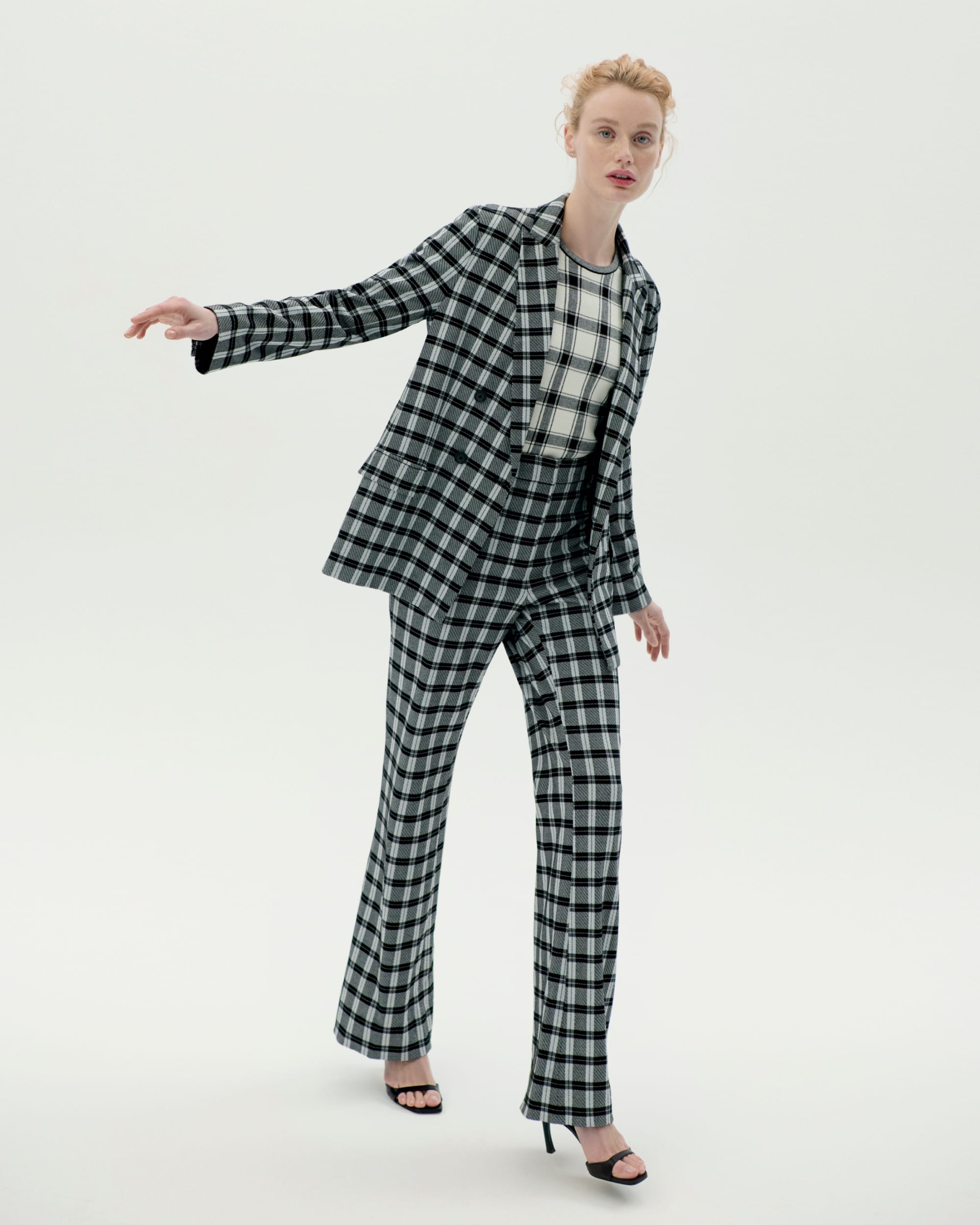 image of a woman wearingt he ohara blazer and horton pant in checkmate with the choe top in bold check