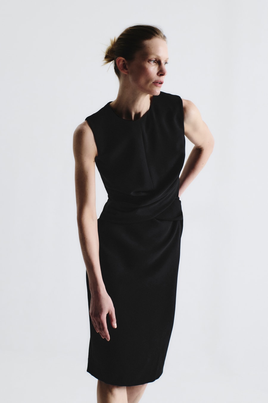 image of a woman wearing the luz dress in black