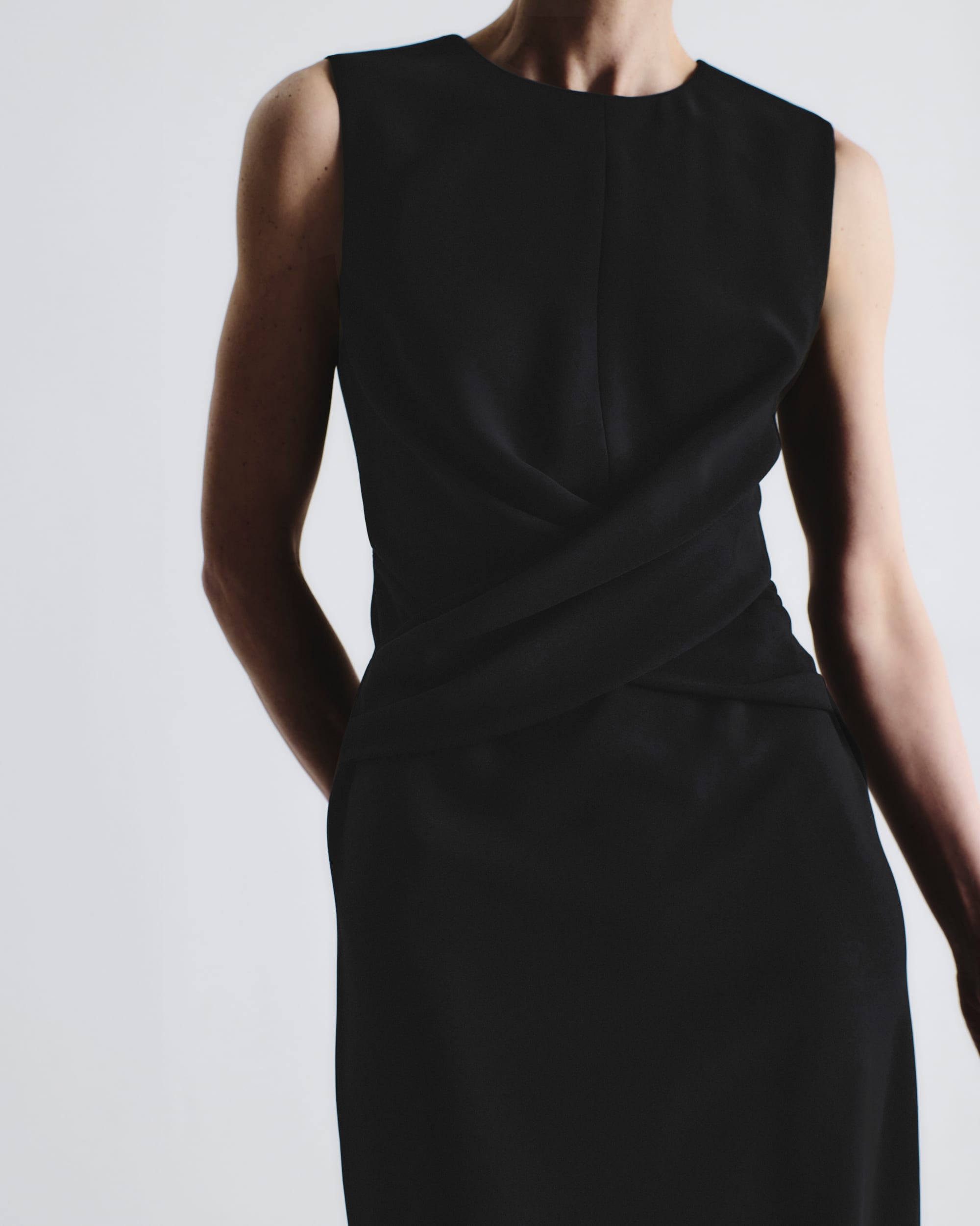 image of a woman wearing the luz dress in black