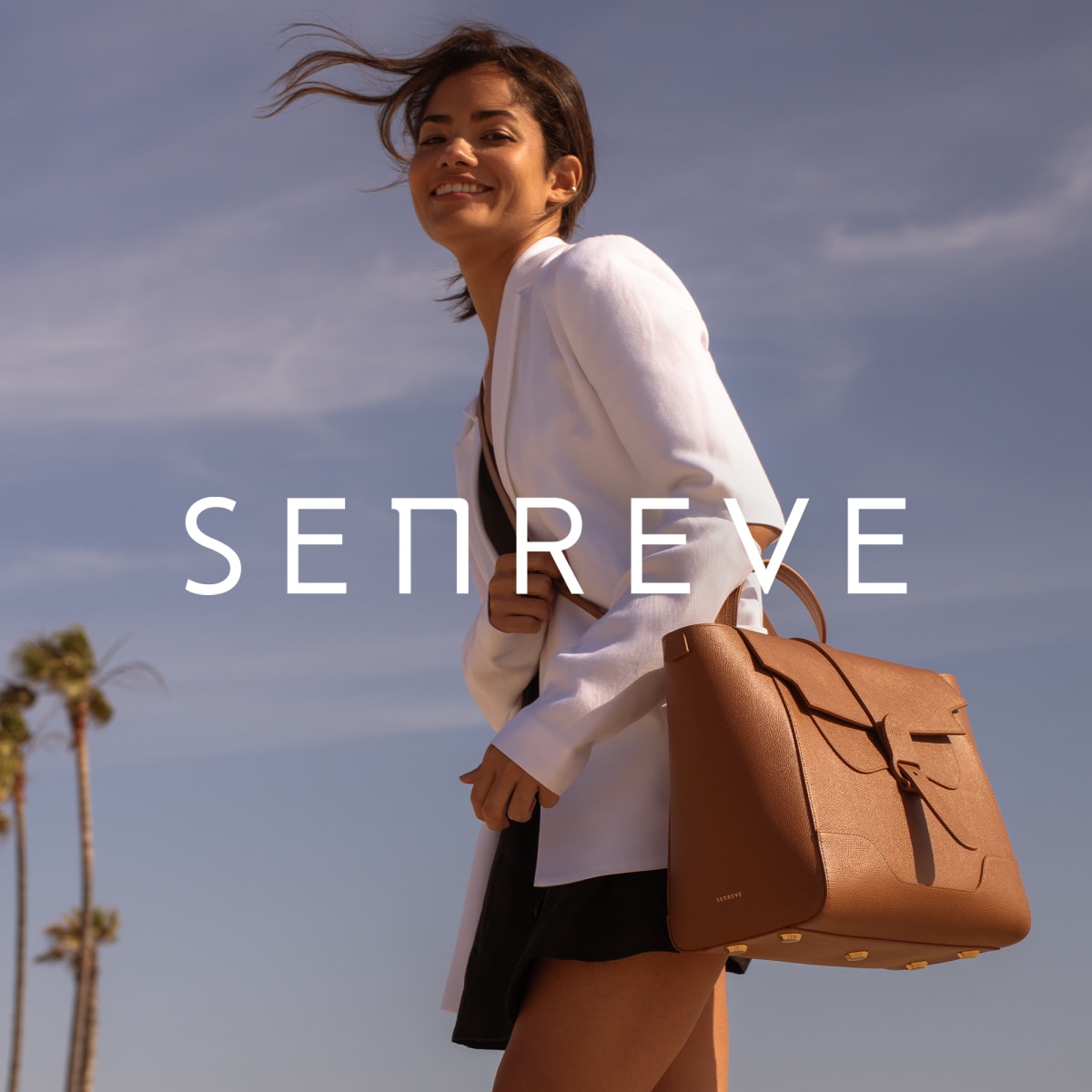 woman wearing Senreve bag + Senreve logo