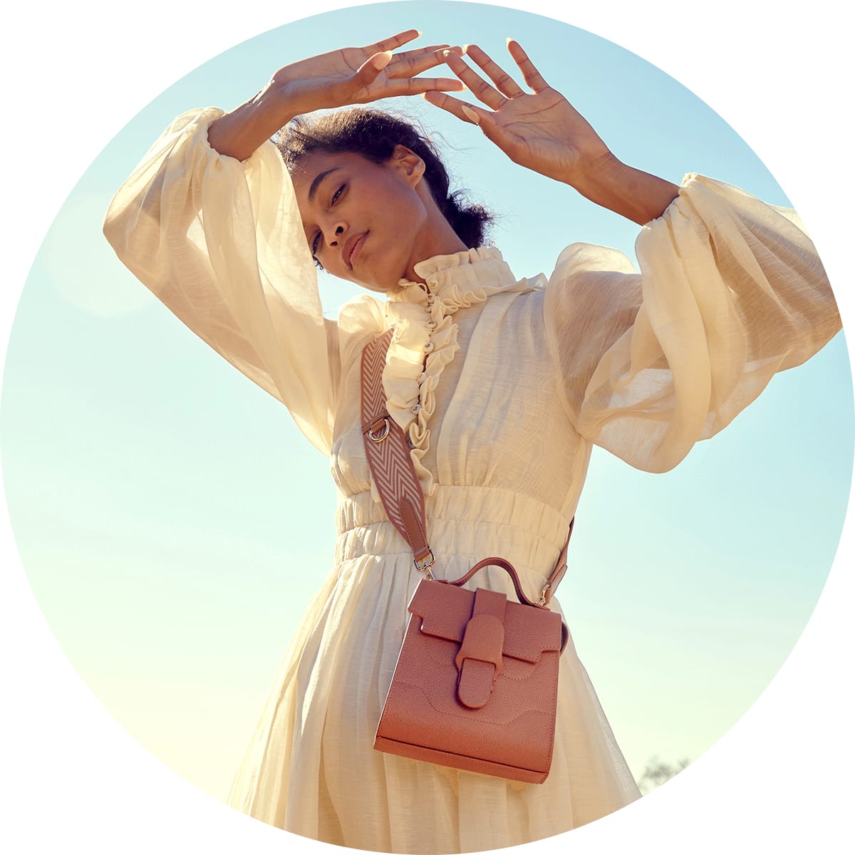 woman wearing yellow dress and Senreve bag
