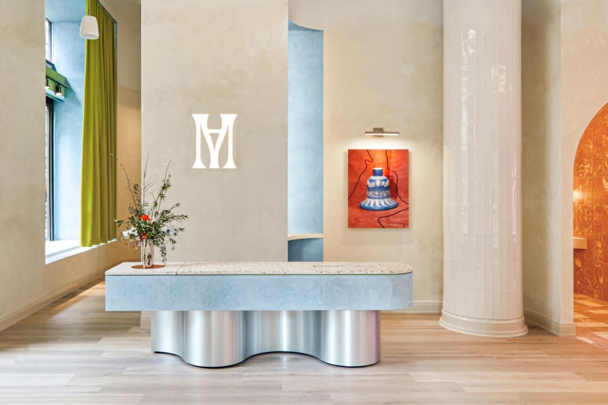 Modern Age clinic: stylish, contemporary space with Modern Age logo on wall