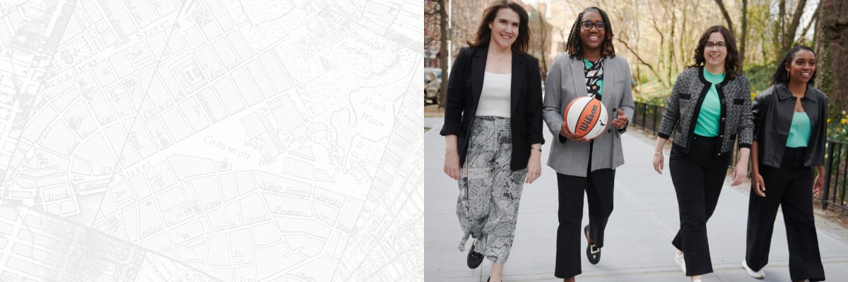 from left to right: Maribeth Gainard, Keia Clarke (CEO of the New York Liberty), Catherine Carlson, and Keia Cole wearing custom M.M.LaFleur x the New York Liberty capsule pieces, walking down the street and smiling