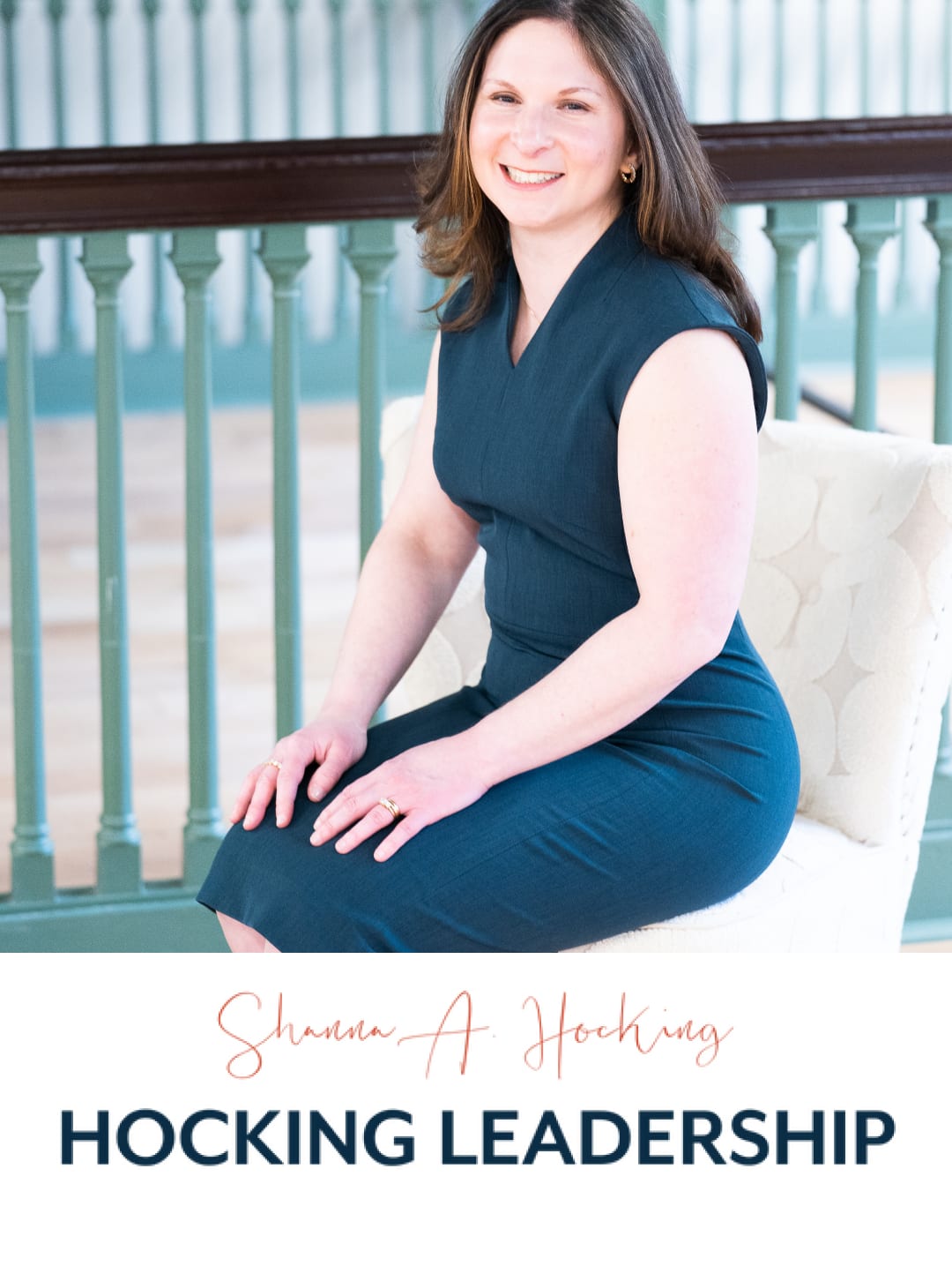 Shanna Hocking in a blue dress sitting on a chair