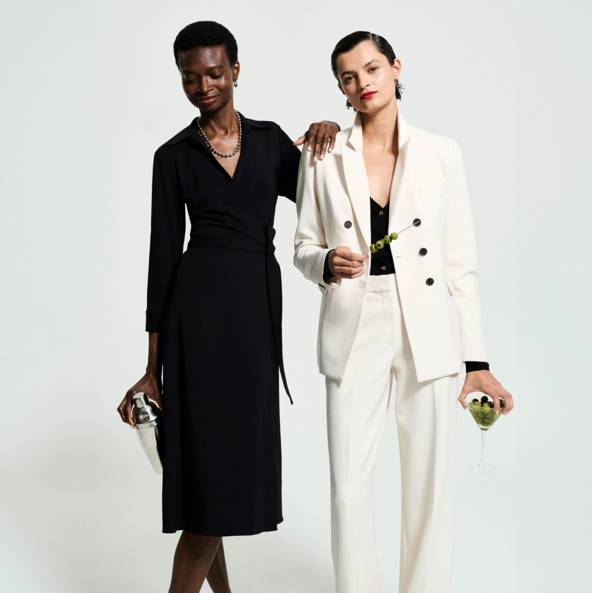 image of two women holding martinis