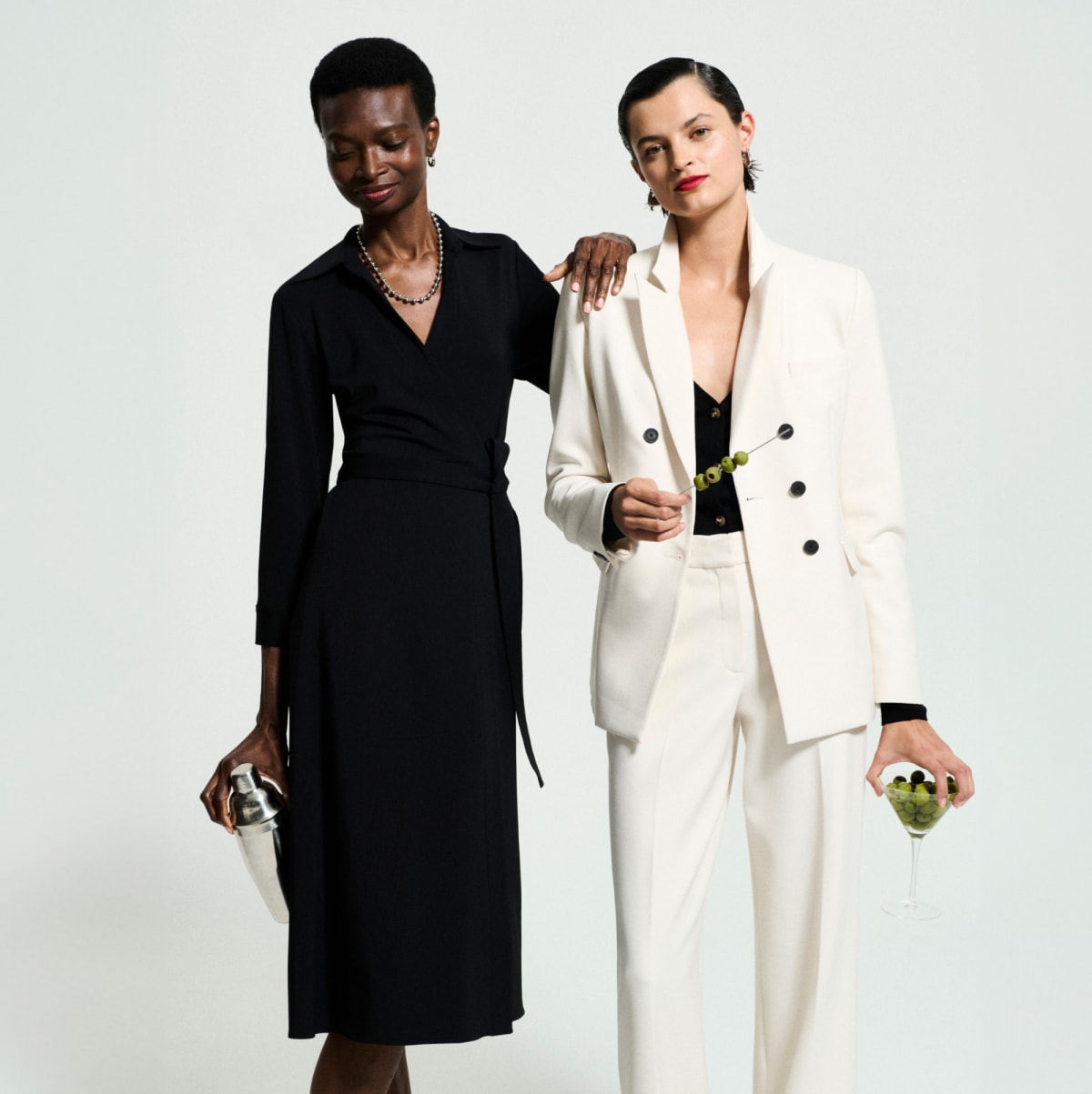image of two women holding martinis