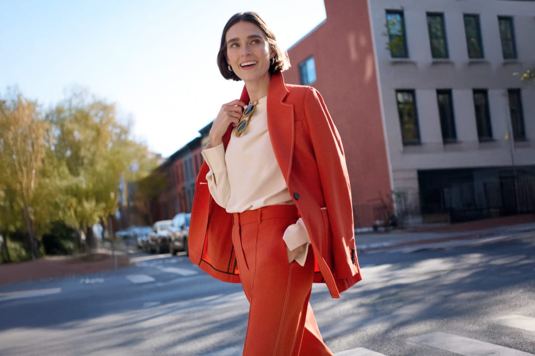 Image of a woman wearing an orange suit