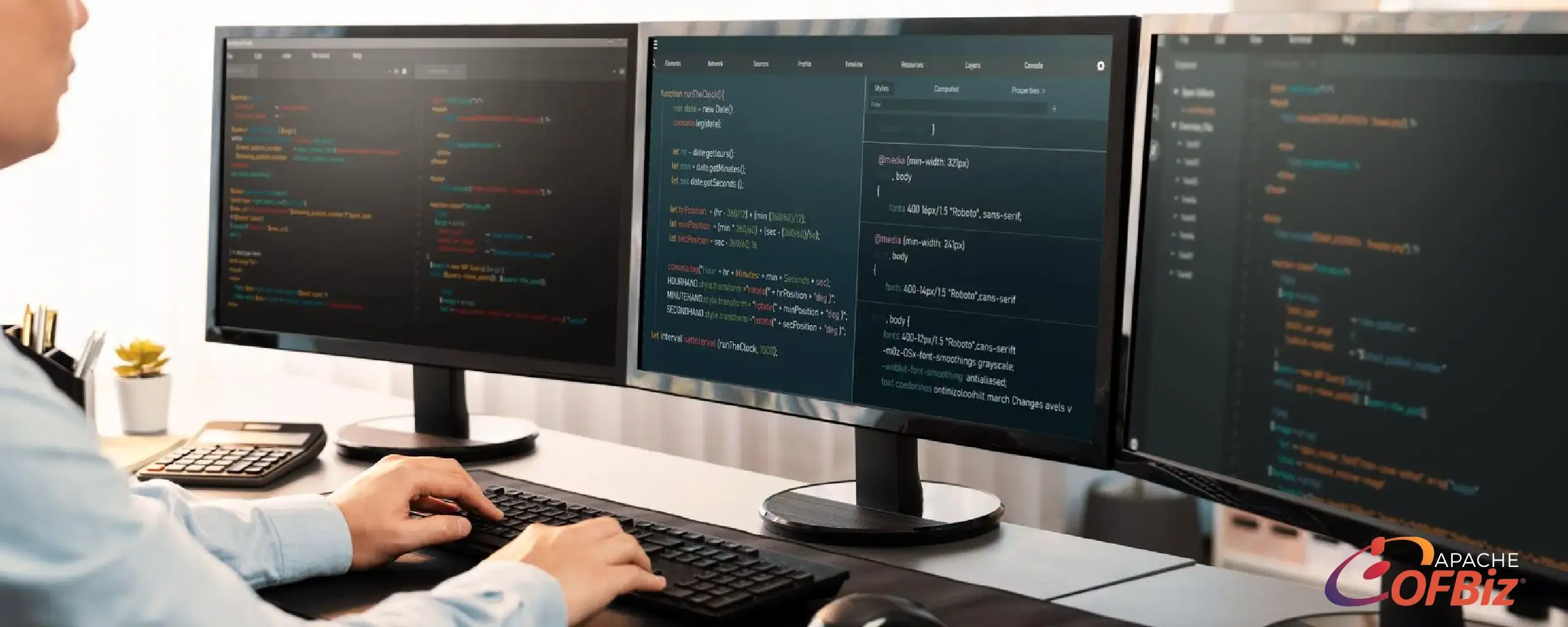Developer working on a custom Apache OFBiz application across multiple monitors