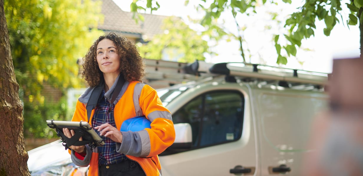 Woman performing inspection holding a tablet