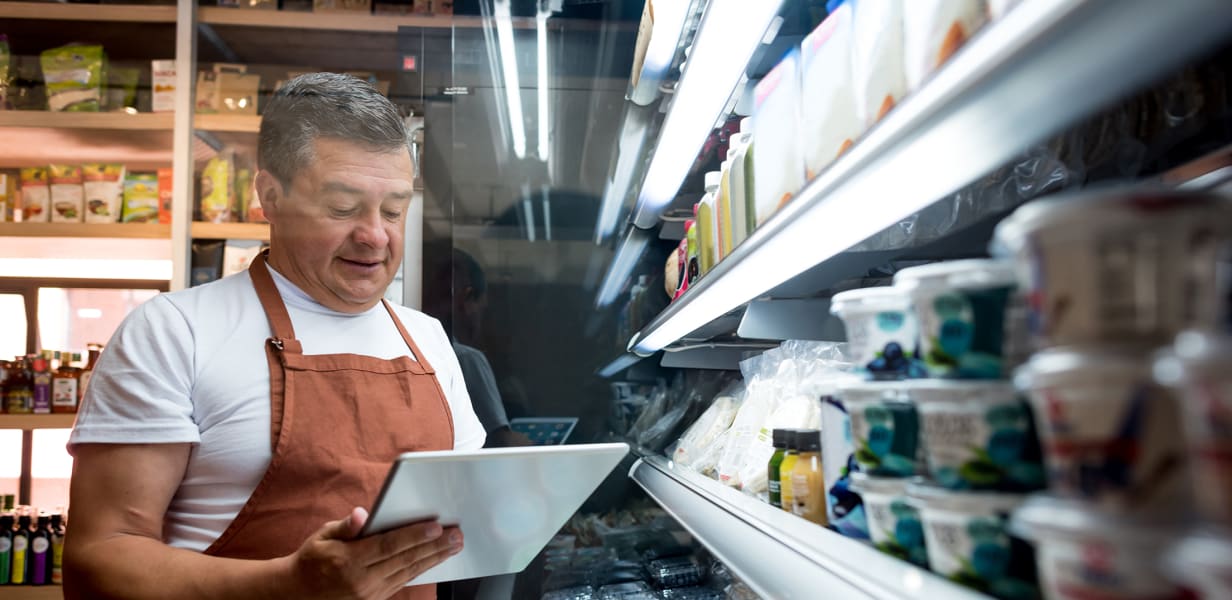 Man conducting food safety inspection on tablet using Formitize app