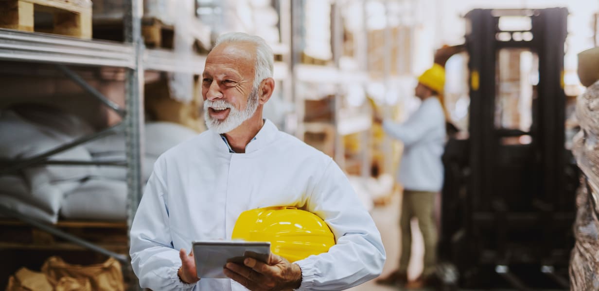 Food safety inspector holding tablet