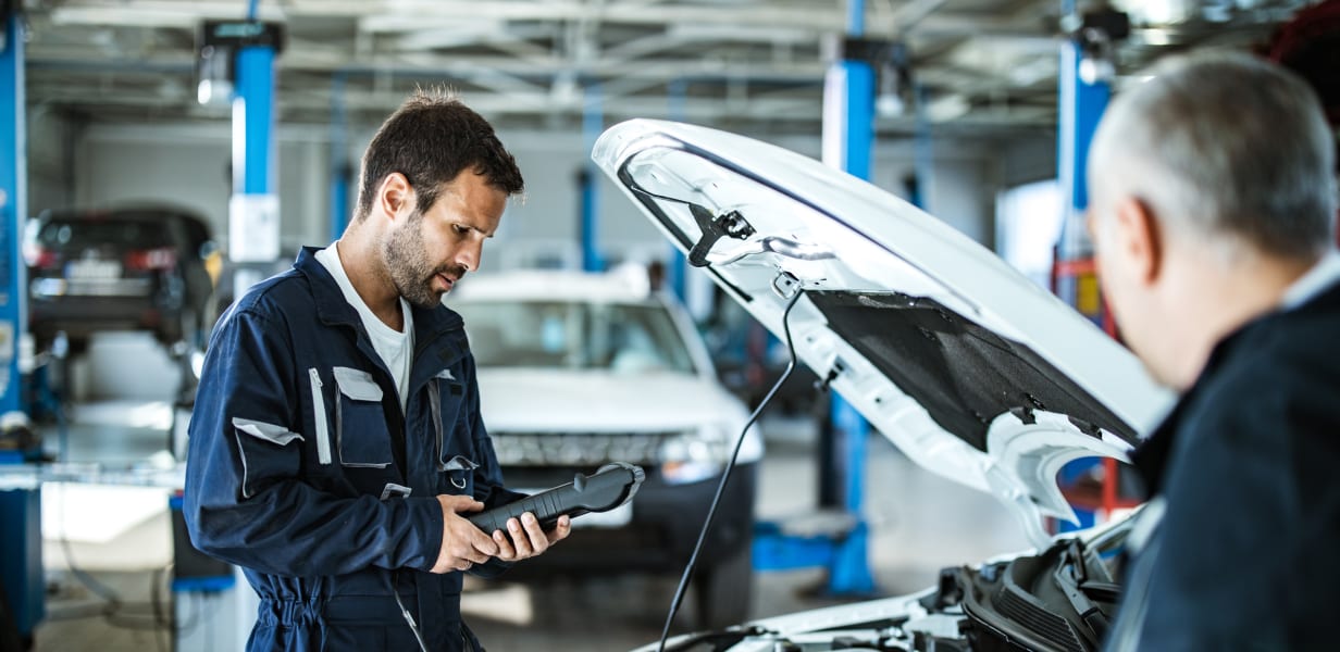 Mechanics performing mobile safety inspection using app