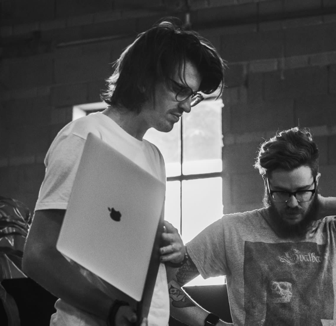 Two designers looking pensive.