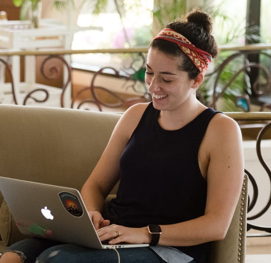 Smiling woman on a laptop