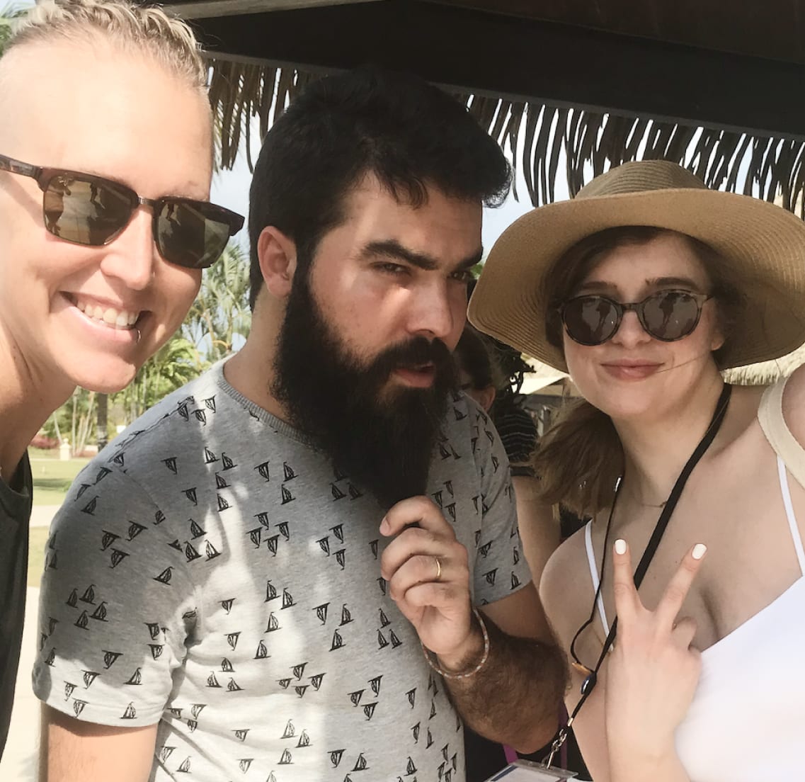 Three team members on the beach