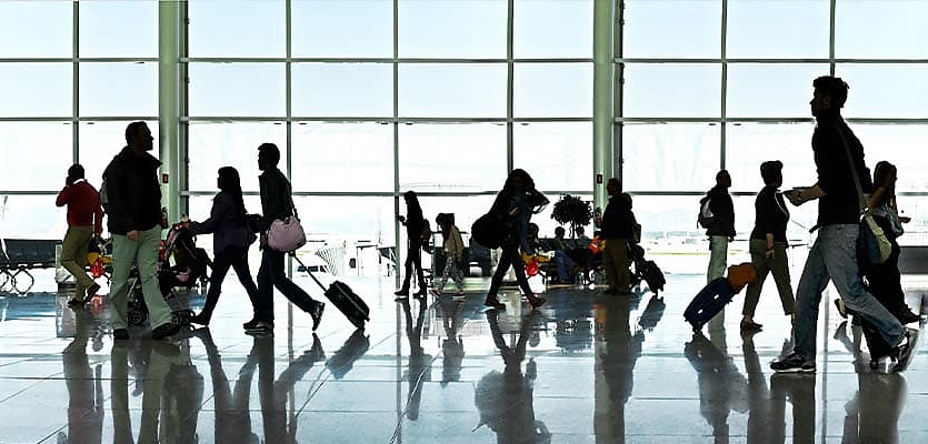 people at airport reb