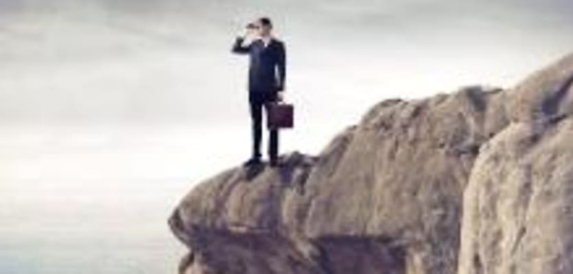 searching man on cliff