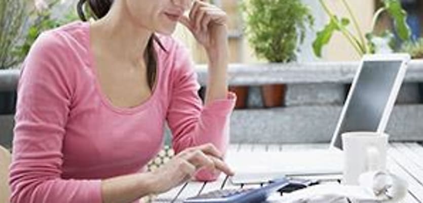 womencalculating expensescalculator Sstock 144544262