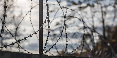 detention prison fence lw