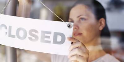 Woman with closed sign