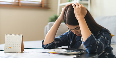 woman stressed money bills hr qbnske