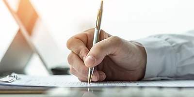 business man writing document myb