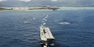 HMAS Adelaide waits for US Marine amphibious assault vehicles to embark during RIMPAC 18