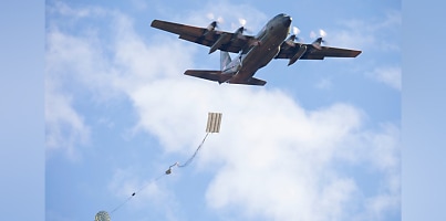 Singapore Air Force C 130H Hercules drops a Heavy Equipment platform dc q2obwy