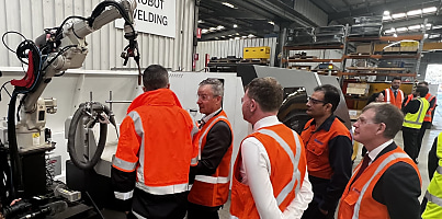 Government officials look over 3D printing at Century Engineering workshop csjmcz