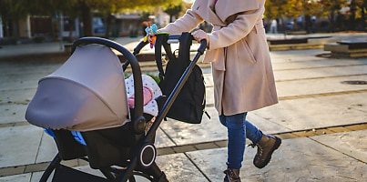 mother pushing baby pram reb xynjvn