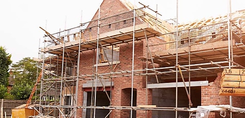 Building approvals fall to decade low