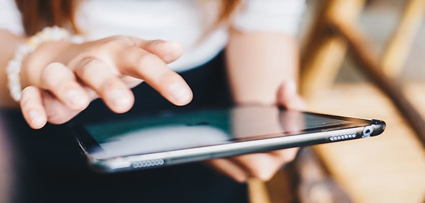 woman using tablet reb