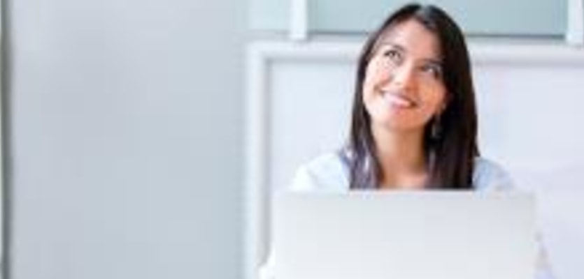 happy businesswoman with laptop