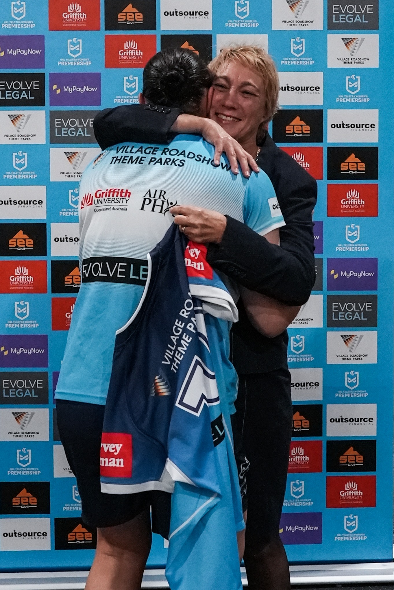 Tanya Sale presenting the official jersey to one of the players at their official sponsors event and jersey presentation on Wednesday 17th August