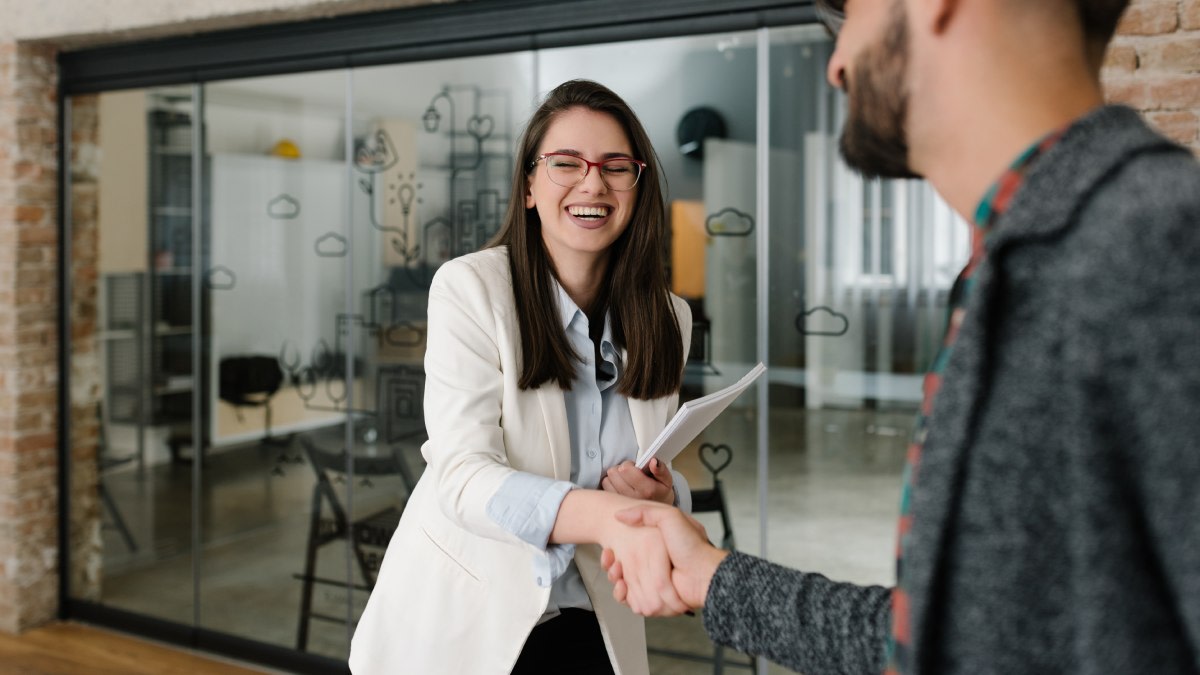 https://res.cloudinary.com/momentum-media-group-pty-ltd/image/upload/v1681267702/Money%20Management/employee-handshake-mm_my15jc.jpg