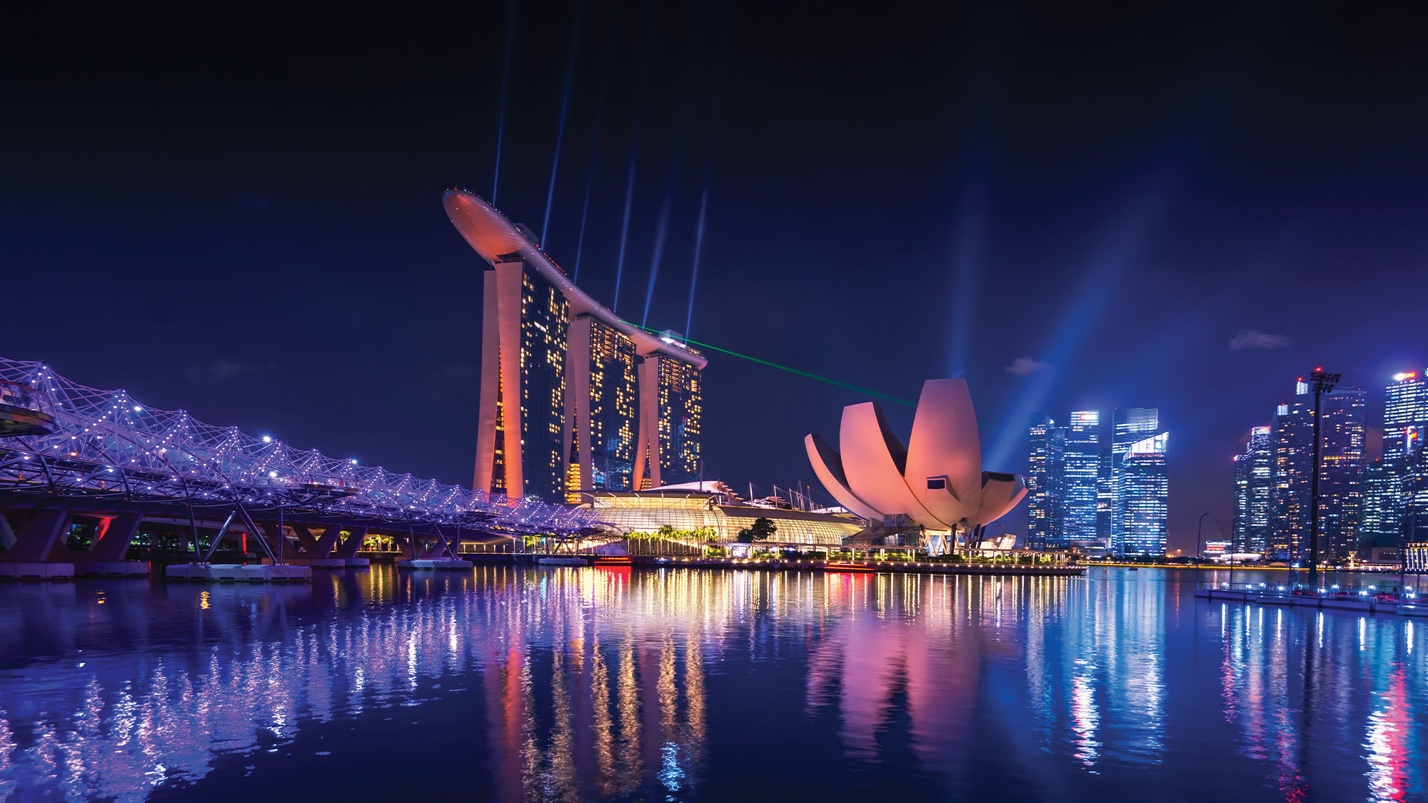 https://res.cloudinary.com/momentum-media-group-pty-ltd/image/upload/v1731301537/Money%20Management/singapore-night-skyline-mm_jibral.jpg