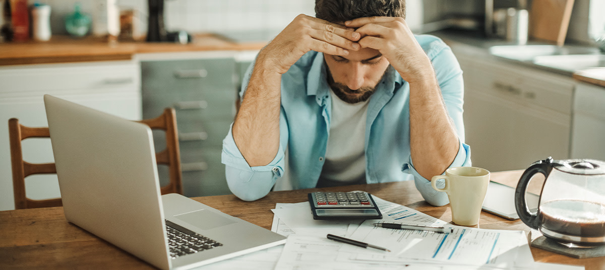 stressed man in debt ta jeahve