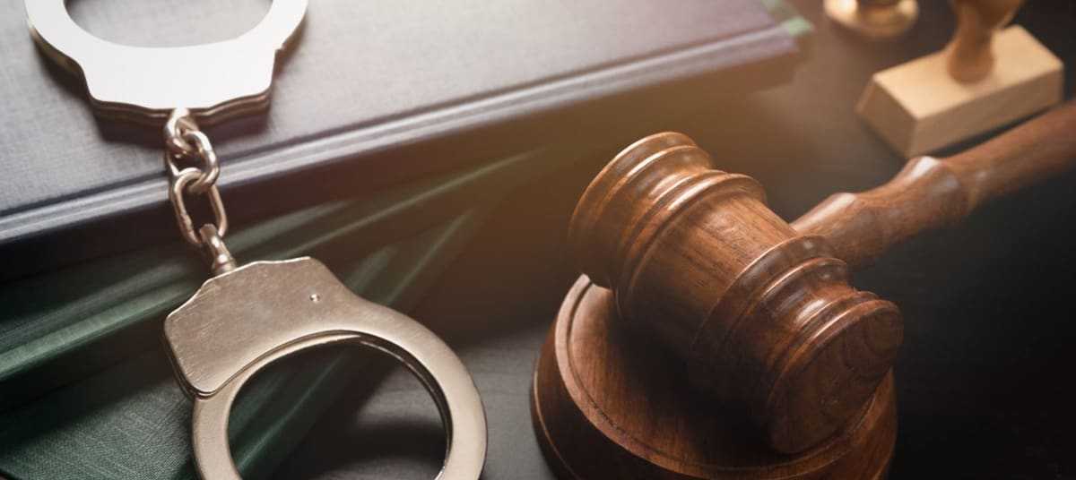 arrest trial verdict handcuffs gavel ta auxsuo