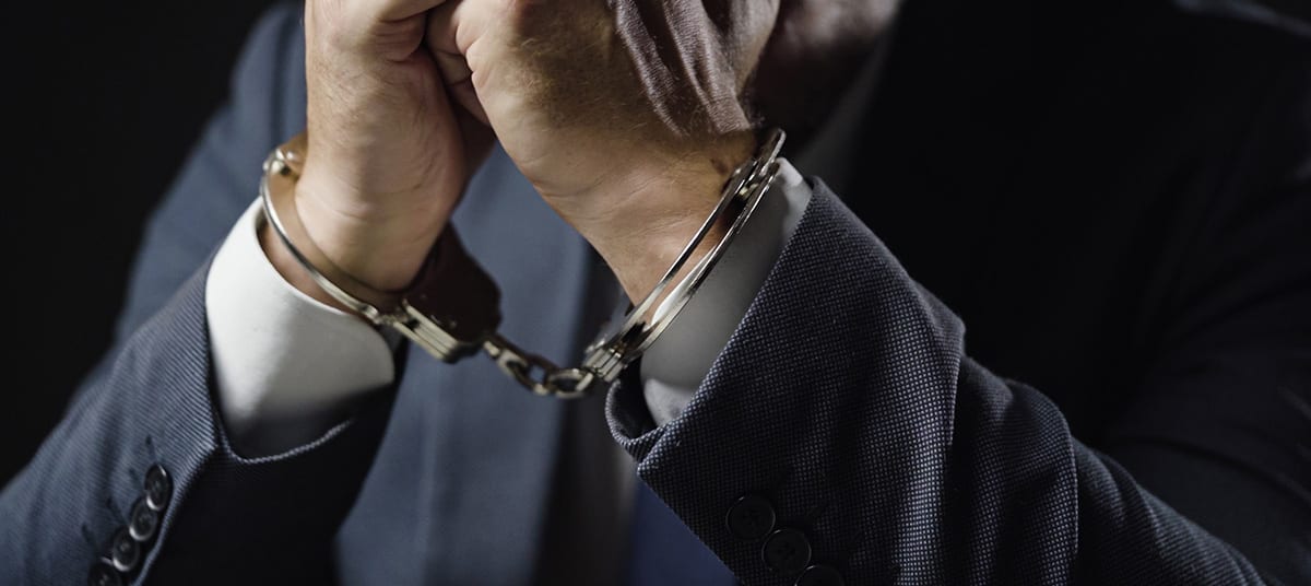 businessman arrested handcuffs ta rs imv