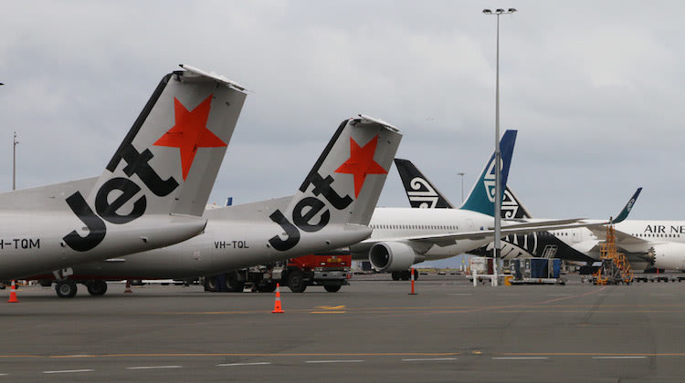 Jetstar Q300s operating New Zealand regional services at Auckland Airport. (Mike Millett)