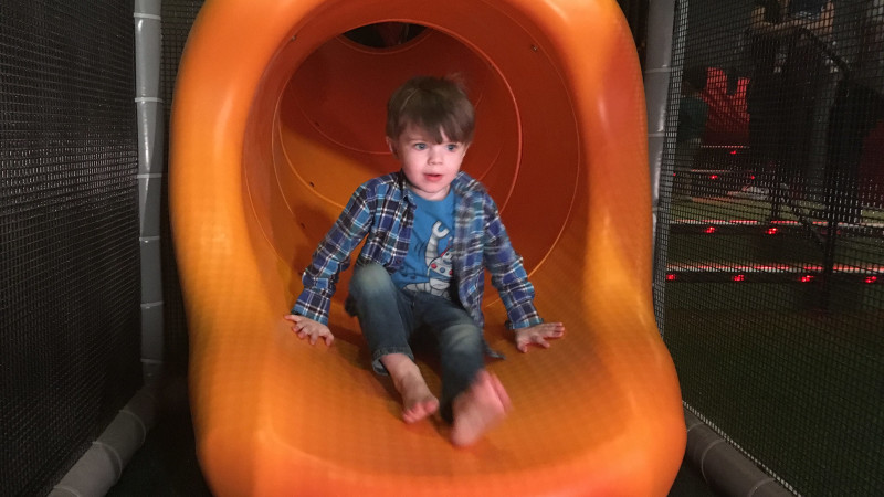 kid playing on indoor playground